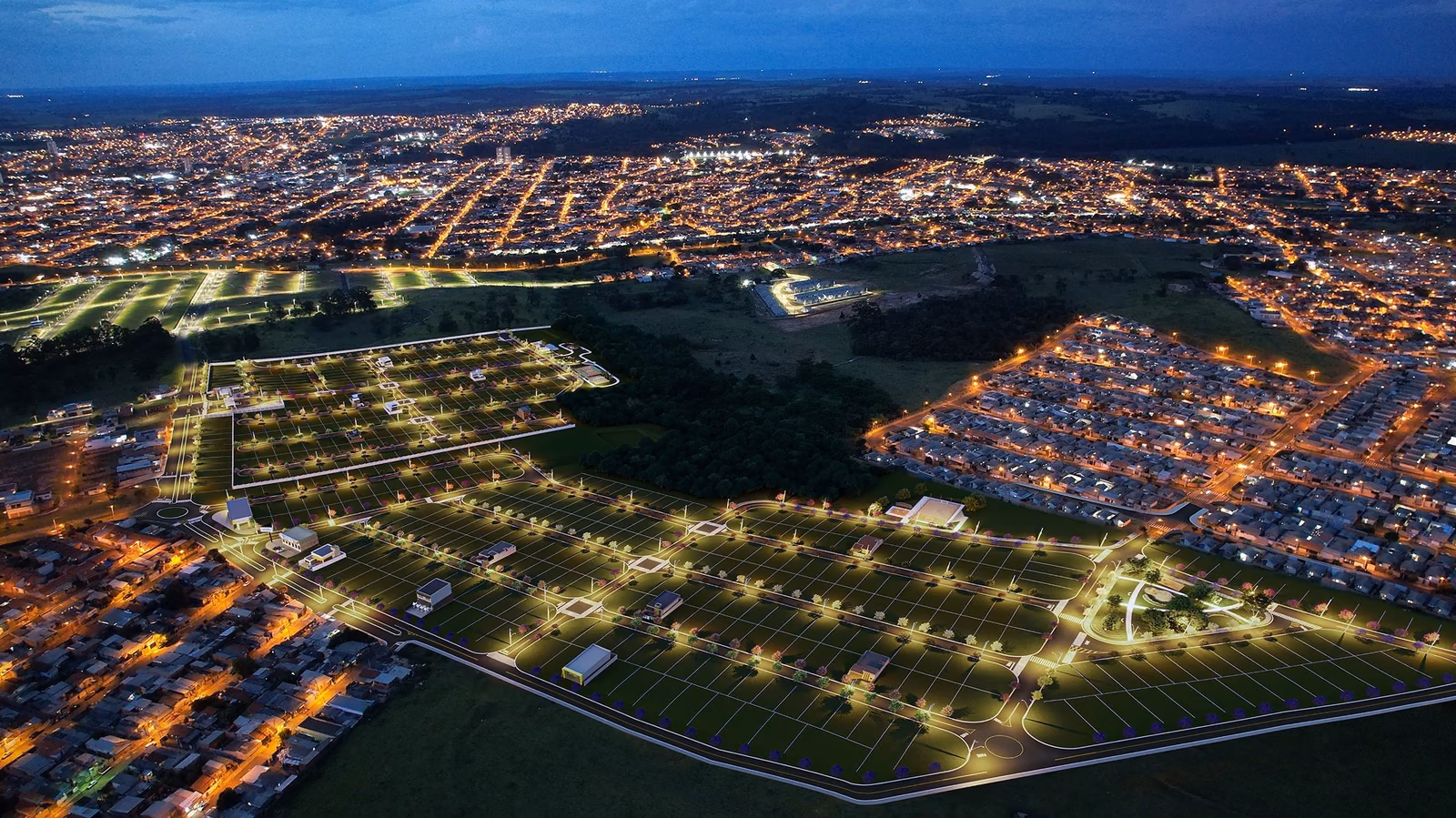 Vista aérea noturna de loteamento com lotes demarcados e ruas iluminadas (imagem ilustrativa)