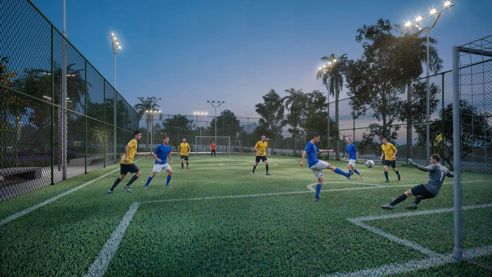 Campo de futebol iluminado à noite